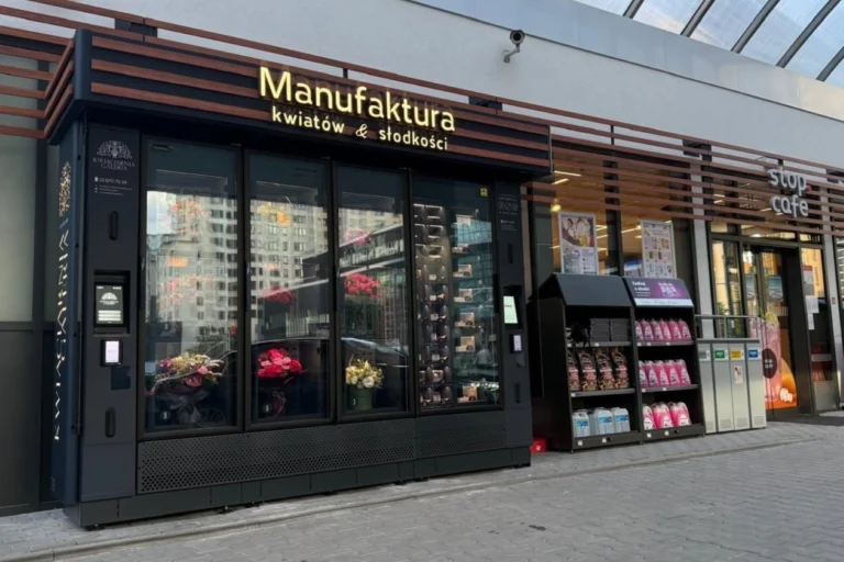 Modern flower vending machine combined with sweets and gift products, allowing customers to purchase bouquets and small gifts around the clock